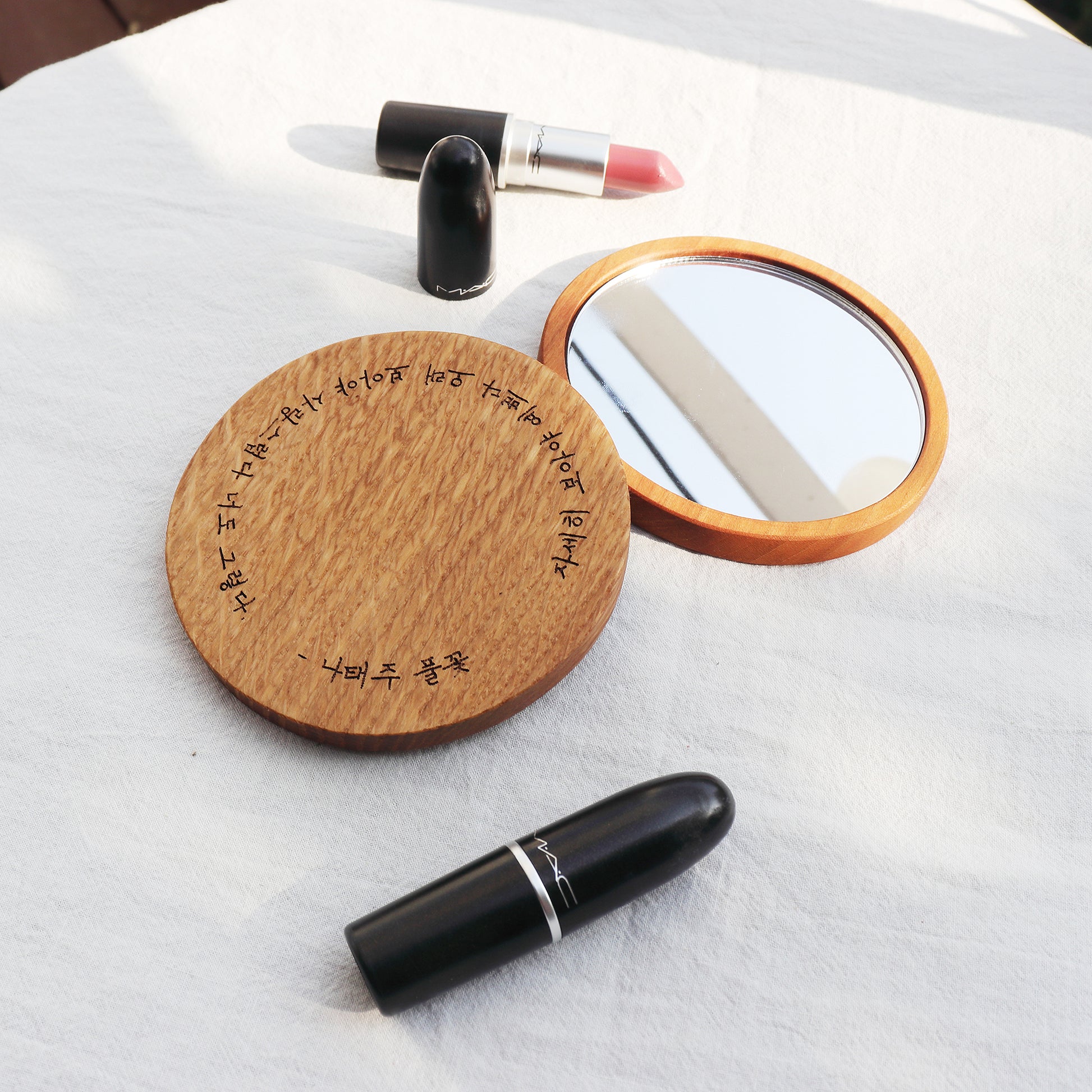 Atelier Hangeul handmade wooden hand mirror with Korean text and drawing