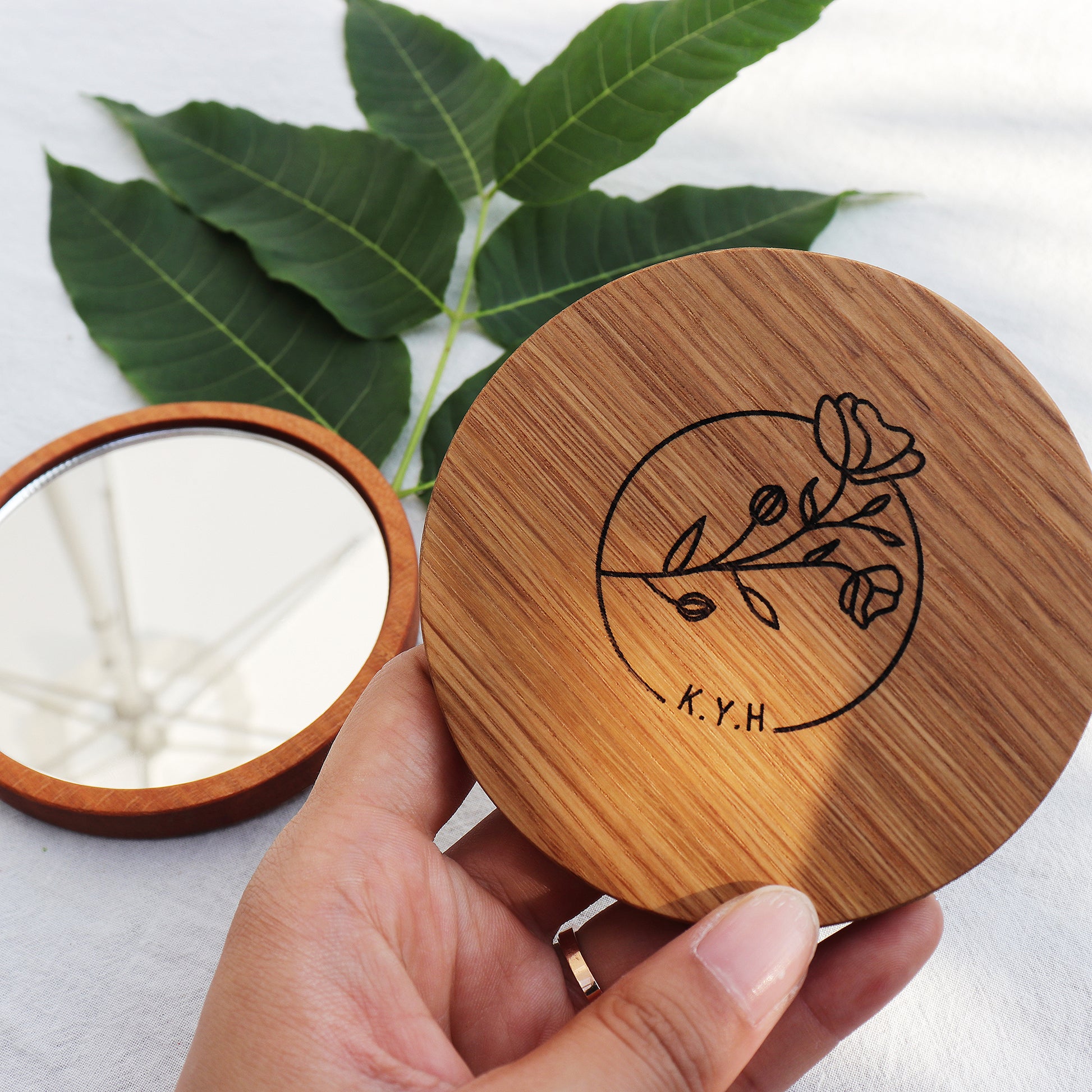 Atelier Hangeul handmade wooden hand mirror with Korean text and drawing